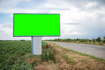 A blank advertising billboard next to the main road