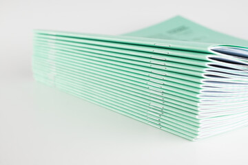stack of thin student notebooks