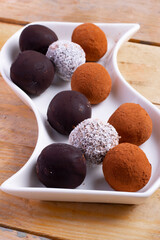 raw healthy vegan chocolate energy balls and truffles with dates and dried fruits