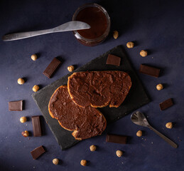 Homemade cocoa cream toast on a dark blue background