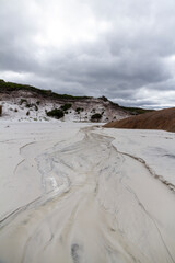  A freshwater stream crosses a white sand beach next to sand dunes and granite rocks. Cape Le Grande, Esperance, Western Australia