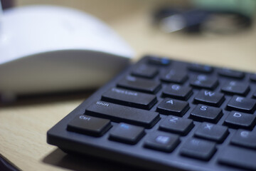 Obraz na płótnie Canvas computer keyboard closeup in black backlight