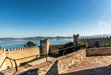 Italy, Umbria,panoramic view of the lake Trasimeno from the walls of an ancient medieval Italian village, foreground walls
