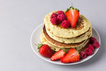 Pancakes of milking and strawberries - a delicious breakfast.