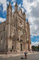 Fototapeta na wymiar Italy, Orvieto, italian art, cathedral of Orvieto, Tuscany, View from below the facade of the cathedral, blue sky background