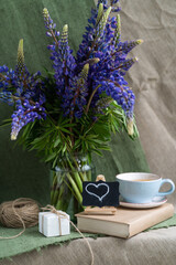 Still life with flowers. Lupins. Greeting card for the holiday. Background.