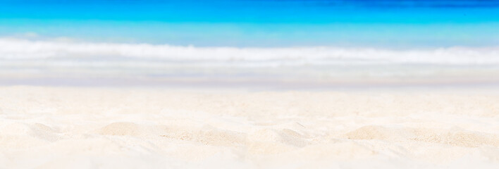 Fototapeta na wymiar Panorama of summer beach and blue sea background.
