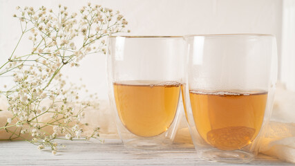 Morning romantic tea for couples. Black tea in regular glass cups. Hot tea in double wall cups. Double walled mugs