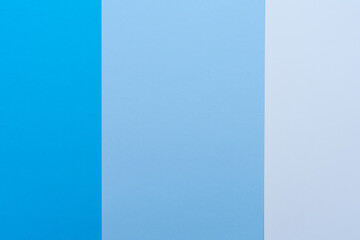 Background of different shades of blue. The colors cut the image vertically. Backgrounds, textures.