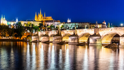 Fototapeta na wymiar Prague night panorama. Prague Castle and Charles Bridge above Vltava River, Praha, Czech Republic