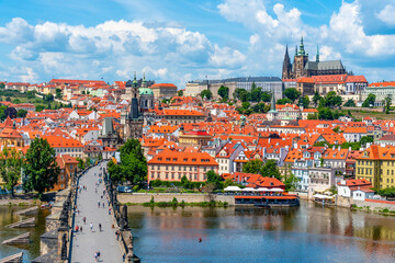 Obraz premium Prague panorama with Prague Castle, and Charles Bridge over Vltava River. View from Old Town Bridge Tower, Czech Republic.