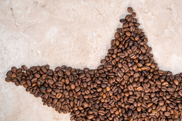 Obraz na płótnie Canvas brown star-shaped natural roasted coffee beans