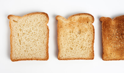 square slices of bread made from white wheat flour toasted in toaster