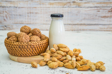 Arrangement of dried fruits almonds and walnuts on rustic old wooden table