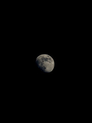 Moon in the darkness of the space