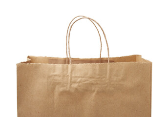 empty disposable brown craft paper bag with handles