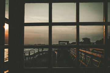 Evening sky view through the panoramic window of a beach house