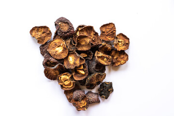 dried medicinal hawthorn fruit on a white background, sliced berries and cooked in a dehydrator
