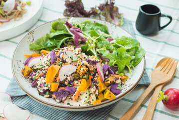 Homemade tasty mixed salad in white plate