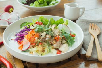 Homemade tasty mixed salad in white plate
