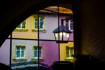 View through a stained glass window on the street of a medieval town in Germany.