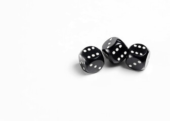 Dice on a white background. Three black dice.