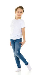 Fototapeta premium Pretty Stylish Girl with Ponytail Standing with Hands on Her Waist.