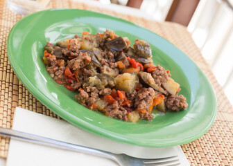 dish of vegetable stew. stewed eggplant, minced meat, carrots, peppers, onion squid