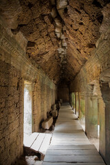 inside the tunnel Bayon temple, Angkor Wat complex, Siem Reap, Cambodia.