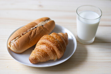 my breakfast this morning. It has croissant bread and milk.