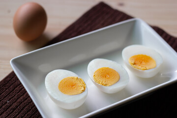 boiled eggs is in a dish.It has cholesterol and nutrients.It is good for health.
