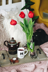 a cup of tea and flowers