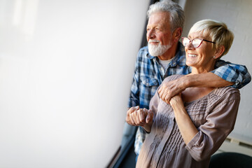 Elderly couple in love. Senior husband and wife hugging and bonding with true emotions