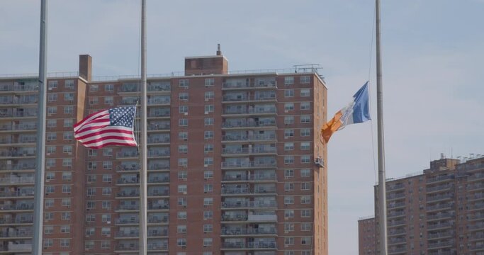 New York City flag and USA flag blowing in wind, slow motion