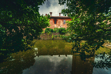 Fototapeta na wymiar moated castle in Lombard Italy countryside