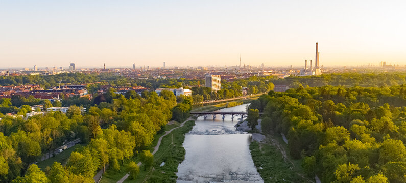 Aerial bird view photograph of Isar river flowing into the south german city of Munich. Munich centre behind river from above
