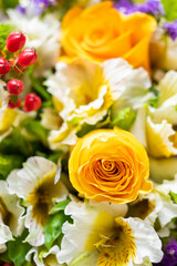 Yellow rose surrounded by beautiful alstroemerias