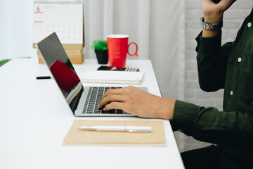 freelancer man businessman talking on mobile phone working at home office