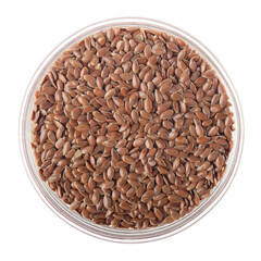Linen seeds in glass bowl isolated on white background flat lay closeup view