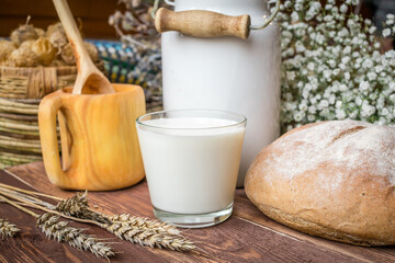 
Milk in a glass and a can stand beautifully on the table