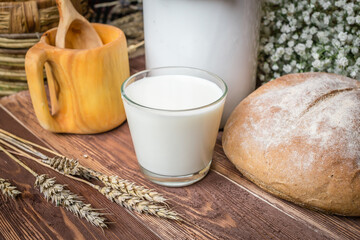 
Milk in a glass and a can stand beautifully on the table