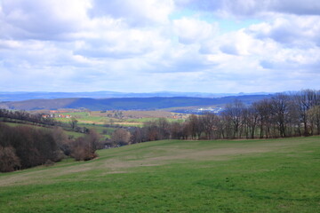 sunny idyllic rural landscape with fields and meadows in Germany