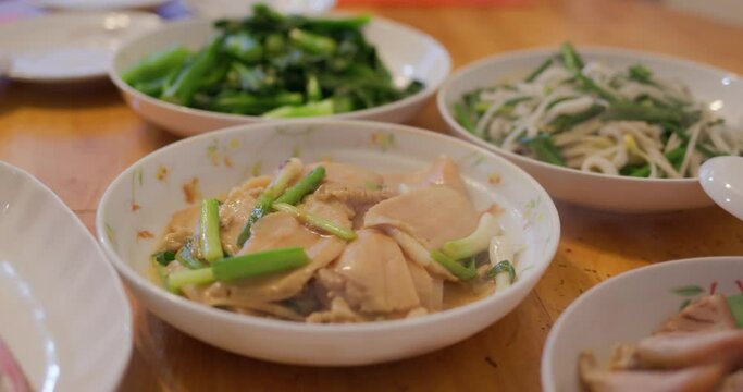 Hong Kong style home cuisine, family dinner concept, steamed fish, fry vegetable and meatpork,