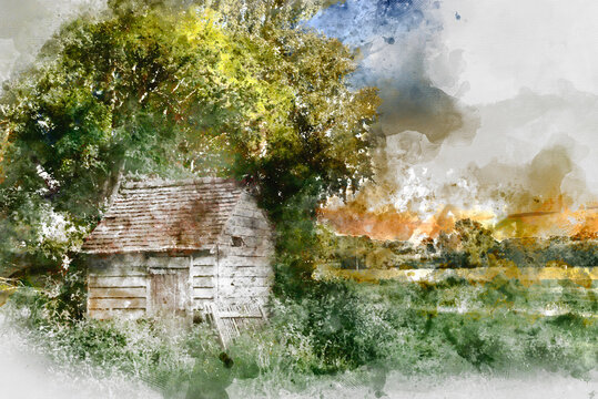 Digital watercolor painting of Stunning landscape image of old derelict farm shed in field during beautiful Summer sunset over distance