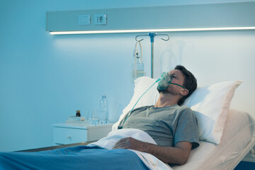 Patient sleeping and wearing an oxygen mask