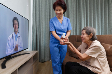 Fototapeta premium Elderly woman sit at home having online consultation with doctor