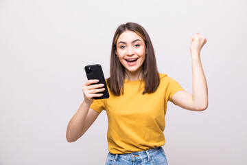 Successful happy woman holding mobile phone isolated on a white background