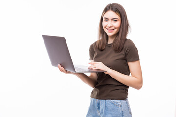 Naklejka premium Young woman working on laptop isolated on white background