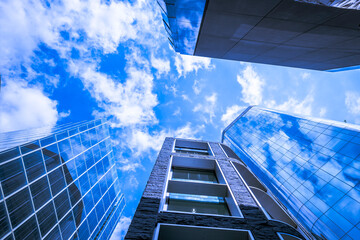 Fototapeta na wymiar Corporate financial office buildings and bright blue sky