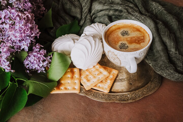 Espresso coffee cup, zephyr and cookies on silver platter. Romantic breakfast. Coffee break.
